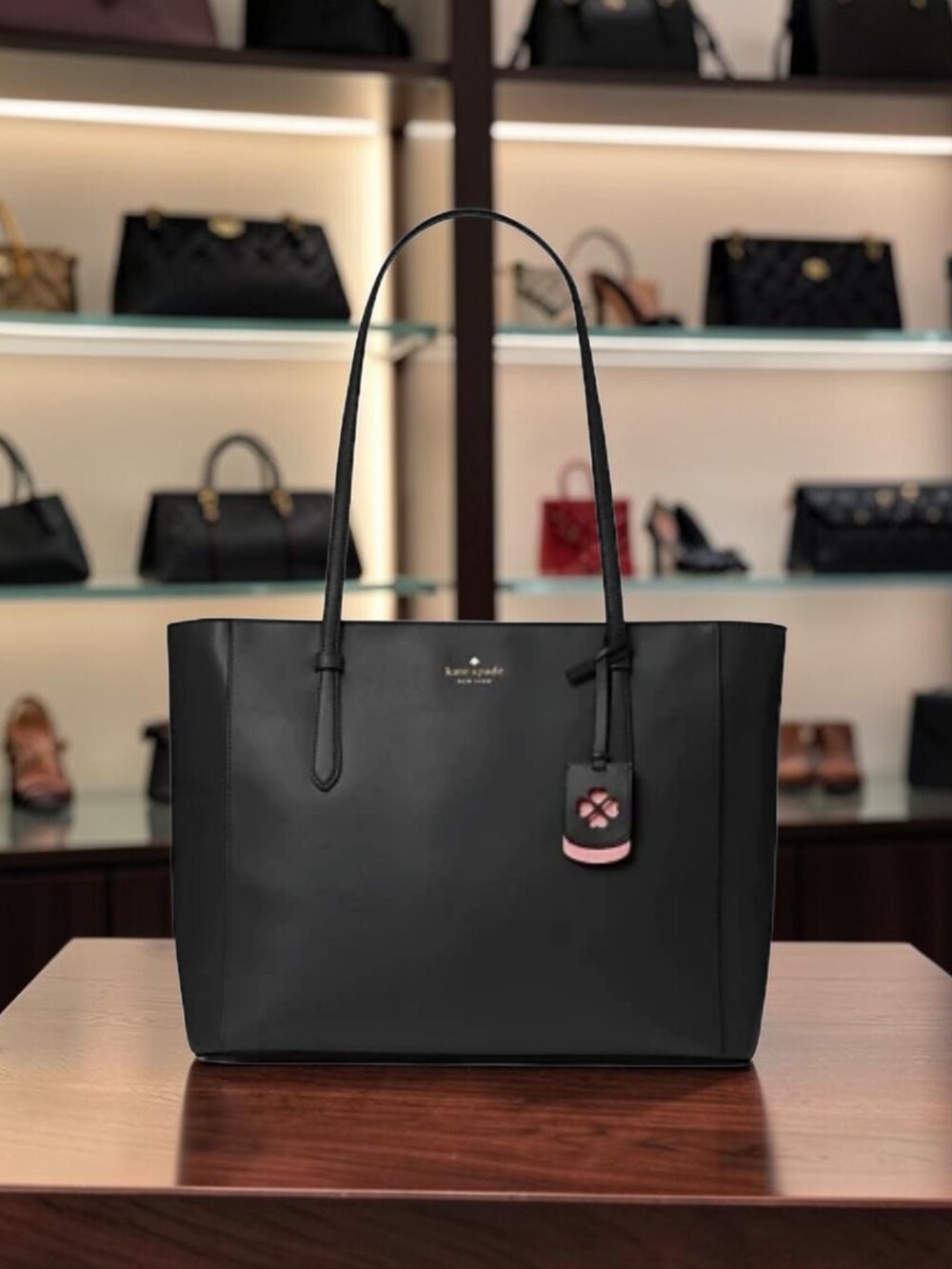 kate spade Black Leather Tote with Pink Charm Accent
